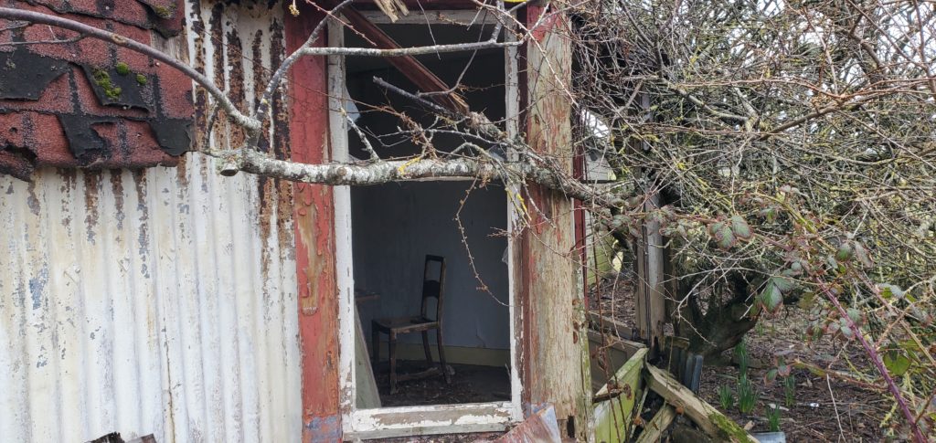 abandoned old farmhouse looking in